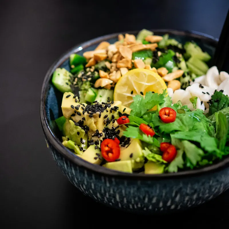 Stock photo: a salad bowl on black in low light